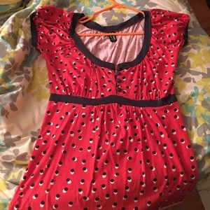 Red polka dot shirt.