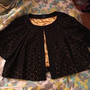 Black and gold short jacket.