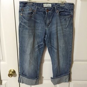 Light wash capris with embellishments on leg