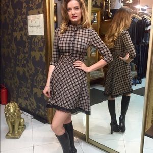 Checkered dress with lace at the hemline