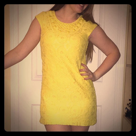 Yellow lace dress by Sandra Darren.