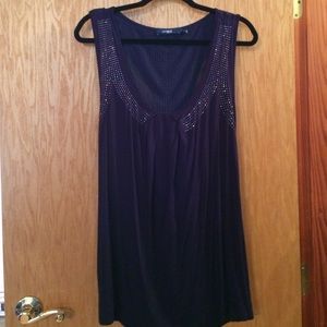 Purple sleeveless top with jewel-like detail.