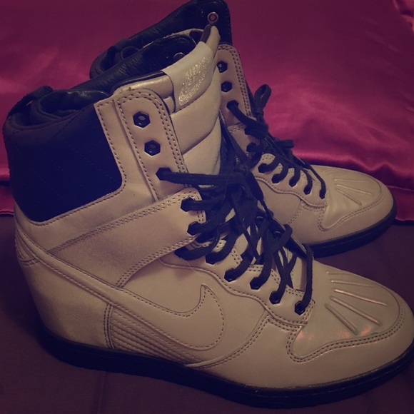 Women's size 7, Nike wedge hightop heel sneaker.