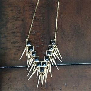 Aldo Black and gold colored spikey long necklace