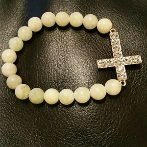 RHINESTONE cross and bead bracelet.