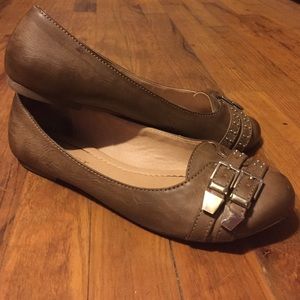Brown buckle flats