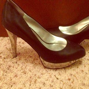 black leather and metallic silver snake heels