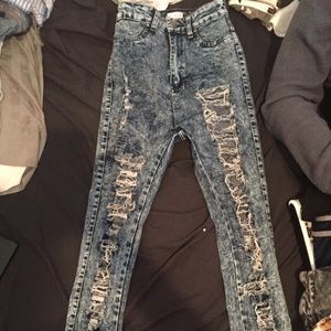 Destroyed acid wash jeans