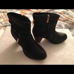 Black Booties for sale! Stylish with gold zippers