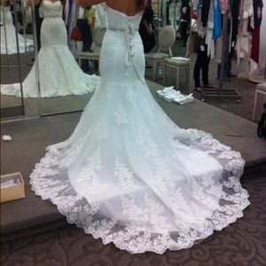 Wedding dress never worn. David's bridal size 4