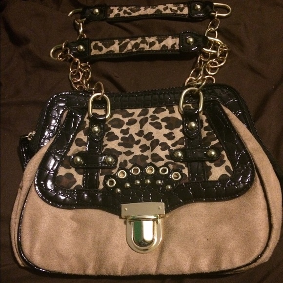 mark. Avon cheetah print purse