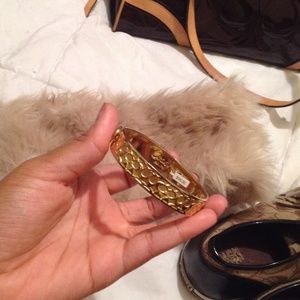 Gold Coach clasp bracelet.
