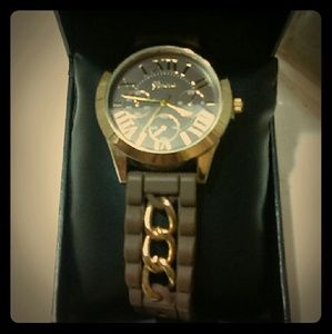 Brown Geneva watch with gold chain