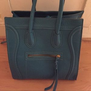Teal bag modeled after the iconic Celine bag.