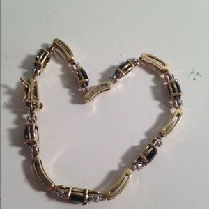Gold, diamond, and sapphire bracelet.