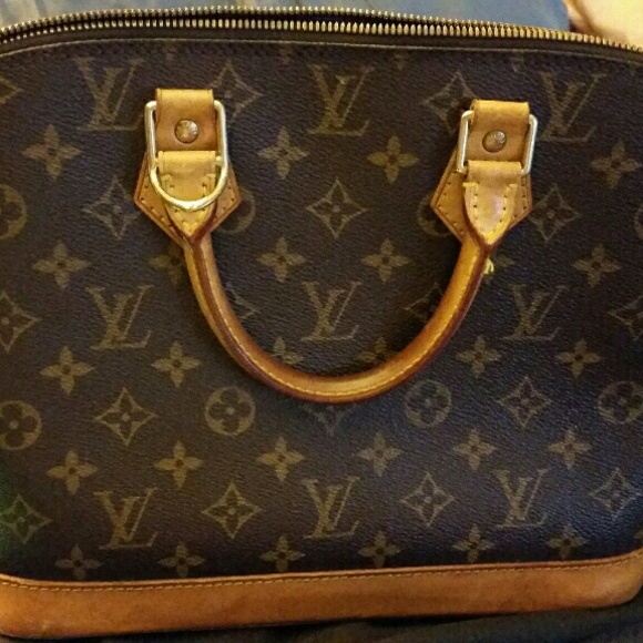 Authentic Louis Vuitton Alma monogram.