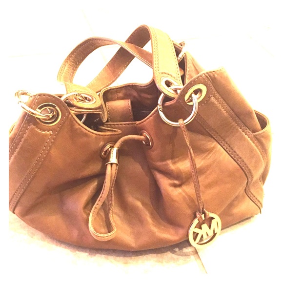 Michael Kors brown purse with gold accents