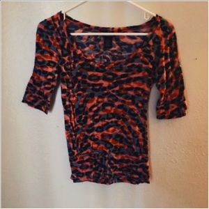 Orange and black shirt.