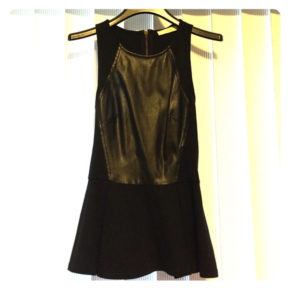 Sleeveless faux leather peplum top.