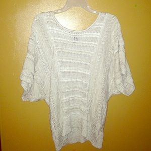 A tan/white sweater'