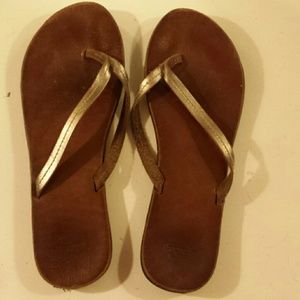 Brown leather flip flops