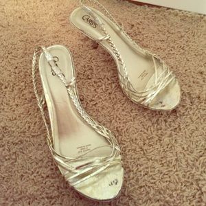 Gold stiletto sling backs