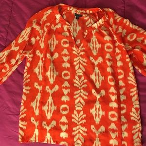 A vibrant orange mid-sleeve blouse
