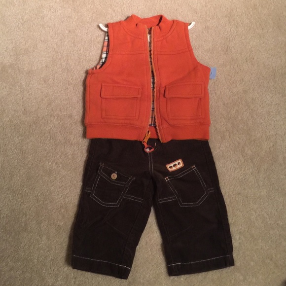 Baby boys Orange vest and brown corduroy pant.
