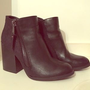 three inch, thick-heeled, faux leather booties.