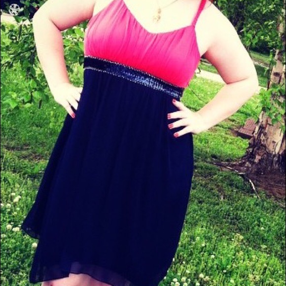 Salmon pink and dark blue knee length dress.