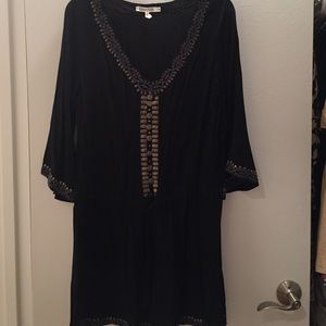 Black details dress with hints of gold sequin and grey threaded patterns