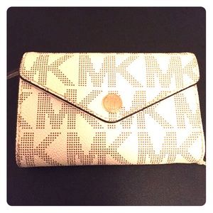 Brand new Michael Kors wallet/phone case.