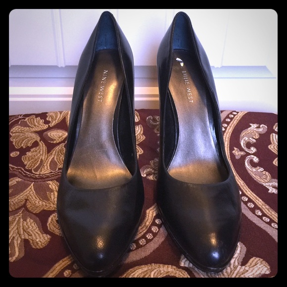 Black leather pumps