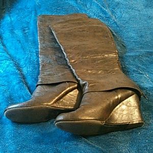 Dark brown below-the-knee wedge boots