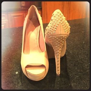 Vince Camuto peep toe pumps.