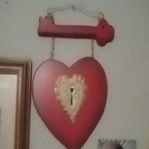 Heart with a key locket to it.