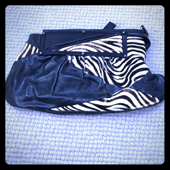 Zebra and black leather clutch