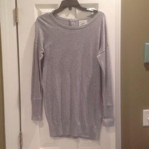 Grey long sweater with zipper detail in back.