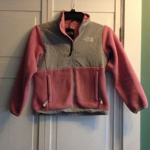 Kids Pink North Face.Some discoloring of sleeves.