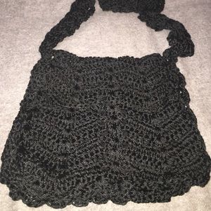 Black Coachella crochet messenger shoulder bag.