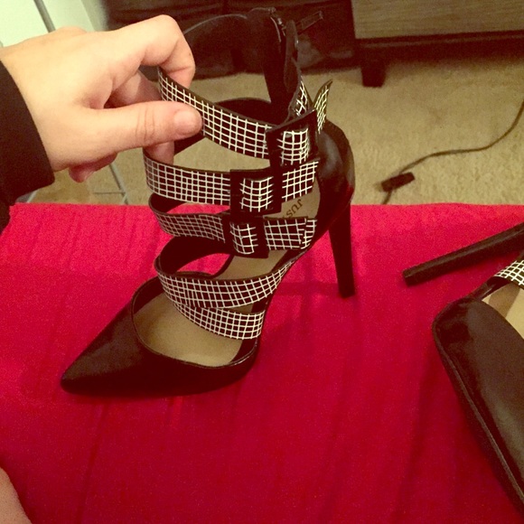 White and Black Strappy pointy toed shoes.