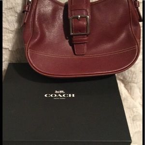 Coach purse with front buckle