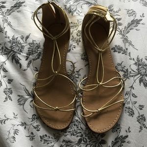 Gold sandals with zipper on back