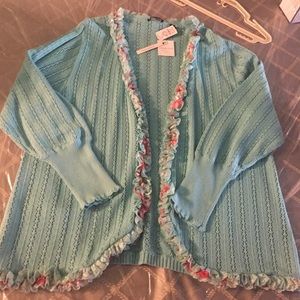 Aqua colored cardigan with ruffle, snap closure