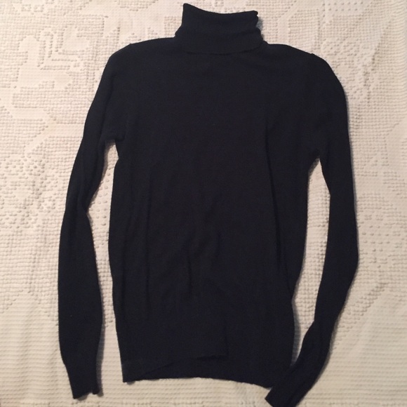 Black turtle neck sweater.