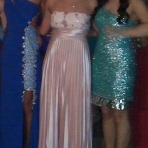 I am selling a blush colored prom dress.