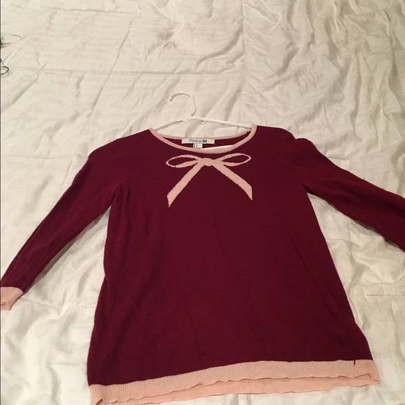 Red sweater with pink bow tie