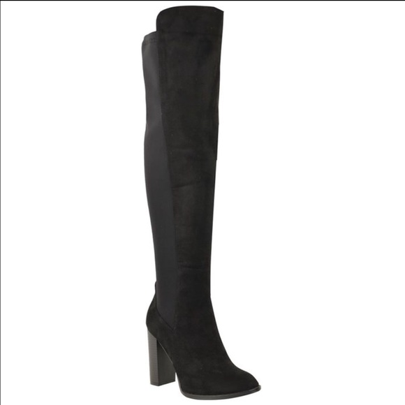 Thigh high boots. Only used to try them on.