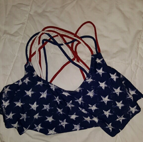 Blue swimsuit top with white stars.