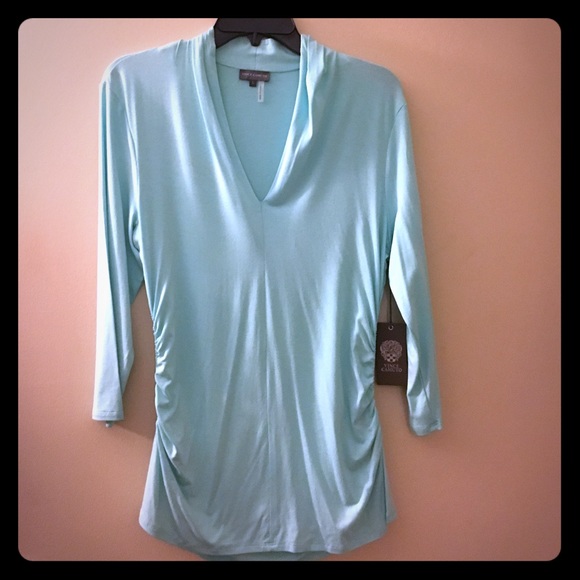 Tiffany blue, V-neck, with rouching on the sides.